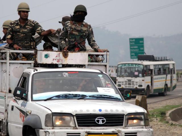 Security personnel escort the first batch of pilgrims for Amarnath Yatra, an annual Hindu pilgrimage to the hill shrine, in Jammu on Friday. Thousands of pilgrims begin an annual pilgrimage to the shrine, an icy stalagmite in a mountain cave 4,115 metres (13,500 feet) above sea level that is worshipped as an incarnation of Lord Shiva, the Hindu god of destruction and regeneration. (Nitin Kanotra/HT Photo)
