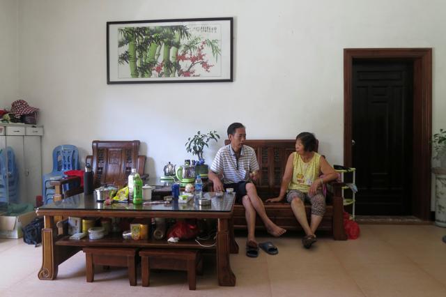 Yang Zhen, wife of arrested village chief Lin Zuluan, talks with another villager in her family's home in Wukan village in the southern province of Guangdong, China. (REUTERS) Yang Zhen, wife of arrested village chief Lin Zuluan, talks with another villager in her family's home in Wukan village in the southern province of Guangdong, China. (REUTERS)