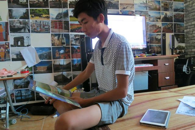 Grandson of arrested village chief Lin Zuluan, Lin Liyi was detained and interrogated by Chinese authorities for twelve hours soon after his grandfather was arrested. Liyi looks at a land blueprint in his room in Wukan village in the southern province of Guangdong. (Reuters) Grandson of arrested village chief Lin Zuluan, Lin Liyi was detained and interrogated by Chinese authorities for twelve hours soon after his grandfather was arrested. Liyi looks at a land blueprint in his room in Wukan village in the southern province of Guangdong. (Reuters)
