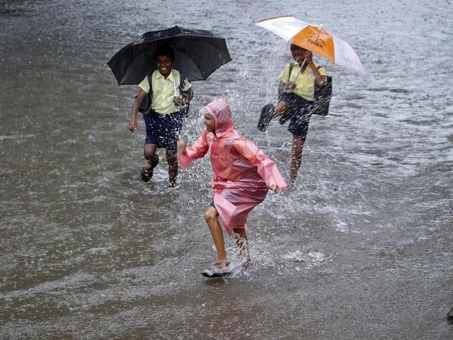 Schoolchildren made the most of the downpour. Wearing school uniform or carrying a bag full of books didn’t seem enough to stop them from having a good run splishing-splashing the water. (Reuters) Schoolchildren made the most of the downpour. Wearing school uniform or carrying a bag full of books didn’t seem enough to stop them from having a good run splishing-splashing the water. (Reuters)