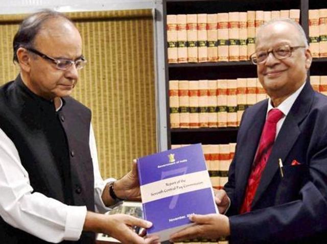 Finance minister Arun Jaitley receives the report of the Seventh Pay Commission from its chairman, justice A K Mathur in New Delhi on Thursday. (PTI)