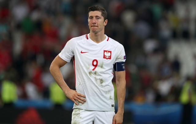 Poland's Robert Lewandowski reacts at the end of the Euro 2016 quarterfinal football match against Portugal. (AP Photo) Poland's Robert Lewandowski reacts at the end of the Euro 2016 quarterfinal football match against Portugal. (AP Photo)
