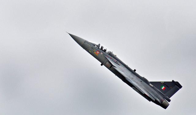 Light Combat Aircraft (LCA) Tejas is displayed by Captain Madhav Rangachari, Commanding Officer of Flying Daggers during its induction ceremony, at HAL (ASTE) in Bengaluru. (PTI Photo) Light Combat Aircraft (LCA) Tejas is displayed by Captain Madhav Rangachari, Commanding Officer of Flying Daggers during its induction ceremony, at HAL (ASTE) in Bengaluru. (PTI Photo)