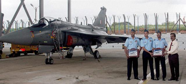 Light Combat Aircraft (LCA) Tejas is inducted into the 45 Squadron (flying dagger) of the IAF at a ceremony, at HAL (ASTE) in Bengaluru. (PTI Photo) Light Combat Aircraft (LCA) Tejas is inducted into the 45 Squadron (flying dagger) of the IAF at a ceremony, at HAL (ASTE) in Bengaluru. (PTI Photo)