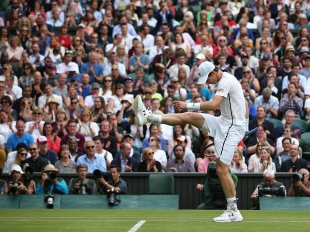 Britain's Andy Murray kicks the ball in frustration while playing Taiwan's Lu Yen-hsun during their men's singles second round match on the fourth day of the 2016 Wimbledon Championships. (AFP Photo) 