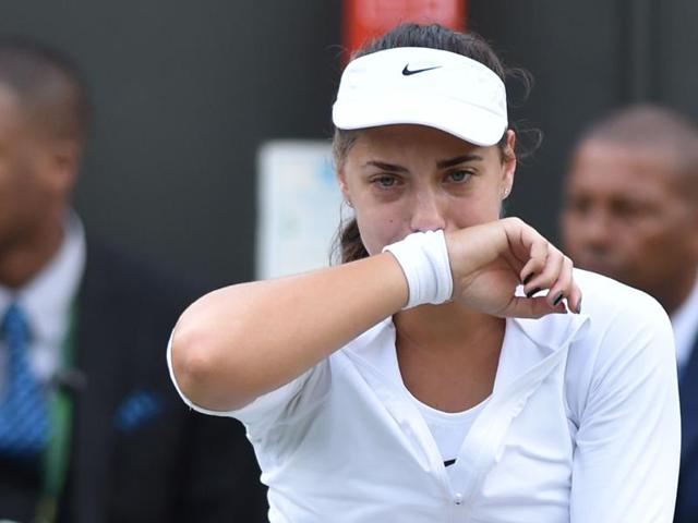 Croatia's Ana Konjuh reacts after stepping on the ball and injuring her ankle in a point against Poland's Agnieszka Radwanska. Konjuh lost 2-6, 6-4, 7-9. (AFP Photo) 