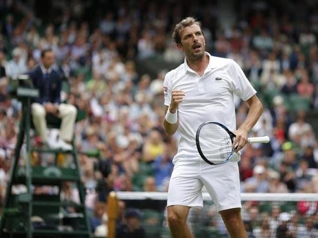 France's Julien Benneteau celebrates winning a point during his match against Japan's Kei Nishikori. (Reuters Photo) 