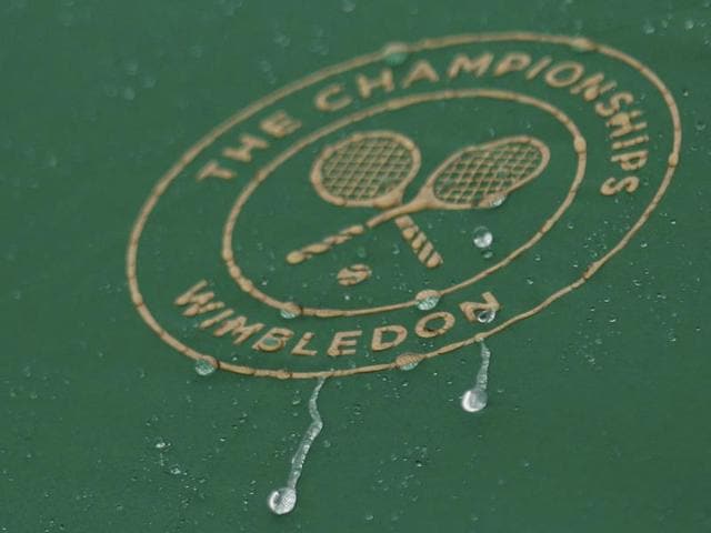 A general view of the Wimbledon logo in the rain. (Reuters Photo) A general view of the Wimbledon logo in the rain. (Reuters Photo)
