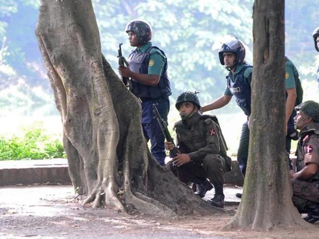Army soldiers take their positions near the Holey Artisan restaurant after Islamist militants attacked the upscale cafe in Dhaka, Bangladesh. (Reuters) Army soldiers take their positions near the Holey Artisan restaurant after Islamist militants attacked the upscale cafe in Dhaka, Bangladesh. (Reuters)