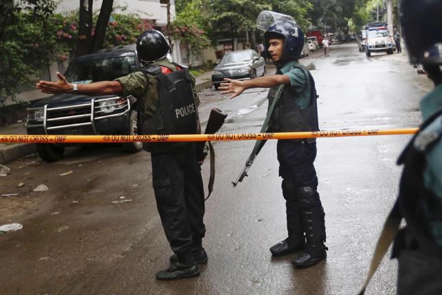 Bangladeshi policemen clear out an area to facilitate action against heavily armed militants who struck at the heart of Bangladesh's diplomatic zone on Friday night, taking dozens of hostages at a restaurant popular with foreigners, Dhaka, Bangladesh, Saturday, July 2, 2016. (AP Photo) Bangladeshi policemen clear out an area to facilitate action against heavily armed militants who struck at the heart of Bangladesh's diplomatic zone on Friday night, taking dozens of hostages at a restaurant popular with foreigners, Dhaka, Bangladesh, Saturday, July 2, 2016. (AP Photo)