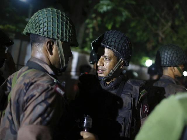 An injured member of the police personnel is carried away by his colleagues. (REUTERS) An injured member of the police personnel is carried away by his colleagues. (REUTERS)
