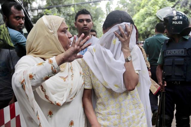 A relative tries to console Semin Rahman, covering face, whose son is missing after militants took hostages in a restaurant popular with foreigners in Dhaka, Bangladesh, Saturday, July 2, 2016. (AP Photo) A relative tries to console Semin Rahman, covering face, whose son is missing after militants took hostages in a restaurant popular with foreigners in Dhaka, Bangladesh, Saturday, July 2, 2016. (AP Photo)