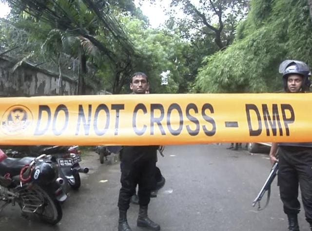 Bangladeshi security forces block the road after militants took hostages at a restaurant popular with foreigners in Dhaka, Bangladesh. (AP) Bangladeshi security forces block the road after militants took hostages at a restaurant popular with foreigners in Dhaka, Bangladesh. (AP)