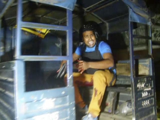 An injured security officer, reacts as he sits in the back of a truck after a gunfight with militants who took hostages at a restaurant popular with foreigners in Dhaka, Bangladesh. (AP) An injured security officer, reacts as he sits in the back of a truck after a gunfight with militants who took hostages at a restaurant popular with foreigners in Dhaka, Bangladesh. (AP)