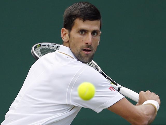 Novak Djokovic of Serbia returns to Sam Querrey of the U.S during their men's singles match. (AP Photo) Novak Djokovic of Serbia returns to Sam Querrey of the U.S during their men's singles match. (AP Photo)