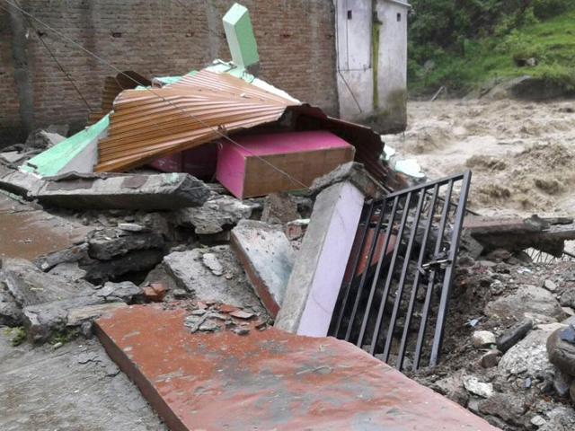 House damaged due to heavy rainfall at Maithana village in Chamoli district, India, on Friday, July 01, 2016. (HT Photo) House damaged due to heavy rainfall at Maithana village in Chamoli district, India, on Friday, July 01, 2016. (HT Photo)