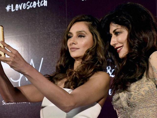 Bollywood actors Chitrangda Singh(R) and Shibani Dandekar take selfie during an event in Kolkata. (PTI)