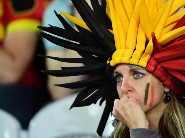 A Belgium supporter reacts after the Euro 2016 quarterfinal football match between Wales and Belgium at the Pierre-Mauroy stadium in Villeneuve-d'Ascq near Lille. Wales won the match 3-1. (AFP Photo) 