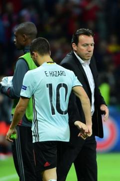 Belgium's forward Eden Hazard (left) shakes hands withcoach Marc Wilmots after the Euro 2016 quarterfinal football match against Wales. (AFP Photo) Belgium's forward Eden Hazard (left) shakes hands withcoach Marc Wilmots after the Euro 2016 quarterfinal football match against Wales. (AFP Photo)