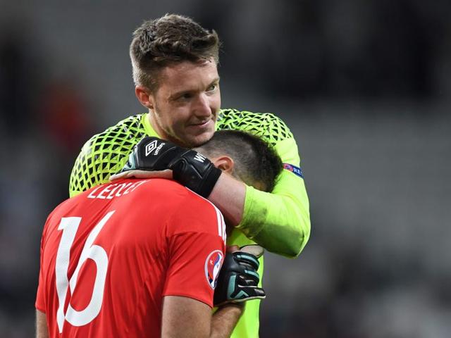 Wales' midfielder Joe Ledley (front) and Wales' goalkeeper Wayne Hennessey celebrate after winning the Euro 2016 quarterfinal match against Belgium.  (AFP Photo) 