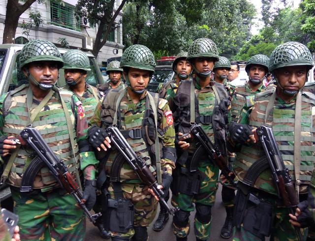 Soldiers gather near the Holey Artisan restaurant after Islamist militants attacked the upscale cafe in Dhaka. (REUTERS) Soldiers gather near the Holey Artisan restaurant after Islamist militants attacked the upscale cafe in Dhaka. (REUTERS)
