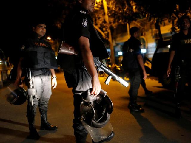 Security personnel keep watch, in the Gulshan area of Dhaka. (Reuters Photo) Security personnel keep watch, in the Gulshan area of Dhaka. (Reuters Photo)
