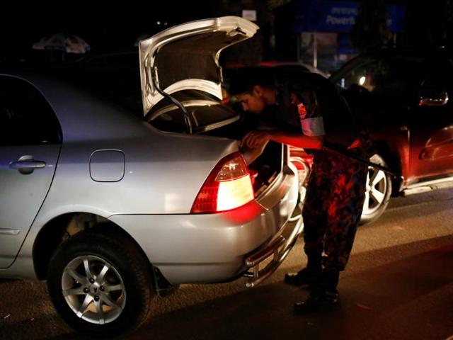Security personnel check vehicles in the Gulshan area of Dhaka. (Reuters Photo) Security personnel check vehicles in the Gulshan area of Dhaka. (Reuters Photo)