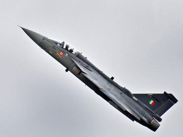 The Indian Air Force’s Tejas fighter warplane at a dress rehearsal for 2014’s Republic Day Parade in New Delhi. The first squadron of the aircraft was raised on July 1 with two Tejas planes. The squadron became a reality more than 30 years after the project was first sanctioned.(HT File Photo)