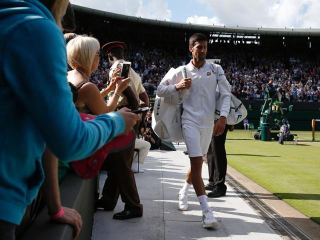 Novak Djokovic walks off court after his loss to Querrey. (AFP) Novak Djokovic walks off court after his loss to Querrey. (AFP)