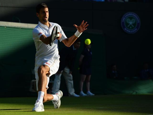 Serbia's Novak Djokovic returns to US player Sam Querrey during their men's singles third round match on the fifth day of the 2016 Wimbledon Championships at The All England Lawn Tennis Club in Wimbledon, southwest London. (AFP Photo) 
