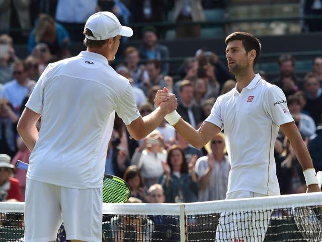 Djokovic and Querrey shake hands at the net after the match. (AFP) Djokovic and Querrey shake hands at the net after the match. (AFP)