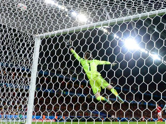 Wales' goalkeeper Wayne Hennessey jumps for the ball during the Euro 2016 quarterfinal match between Wales and Belgium at the Pierre-Mauroy stadium. (AFP Photo) 