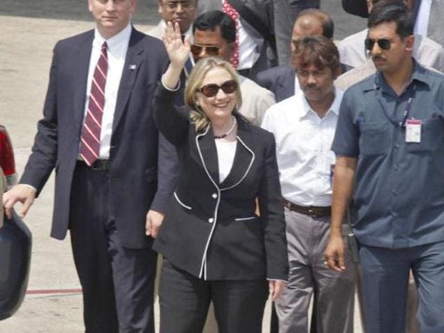 Hillary Clinton, surrounded by Indian security personnel, waves upon her arrival at an airport in Kolkata. (Reuters File Photo) Hillary Clinton, surrounded by Indian security personnel, waves upon her arrival at an airport in Kolkata. (Reuters File Photo)