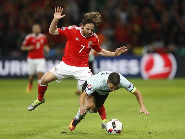 Wales' Joe Allen fouls Belgium's Eden Hazard. (Reuters Photo) 