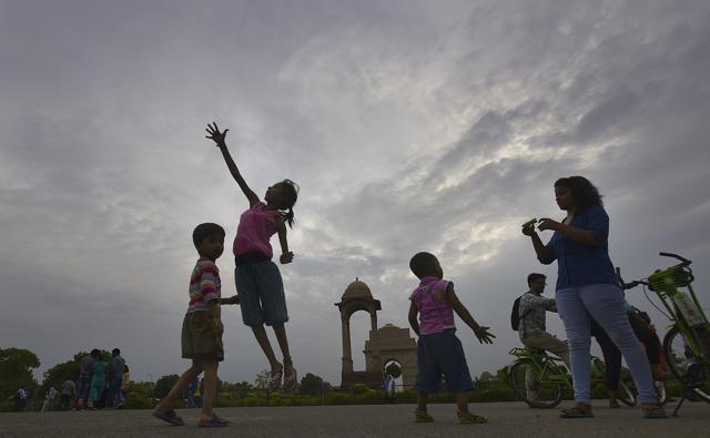 People enjoy pleasant weather after the Ppe- monsoon shower sat India in New Delhi on Saturday, July 2, 2016. (Raj K Raj / HT Photo )