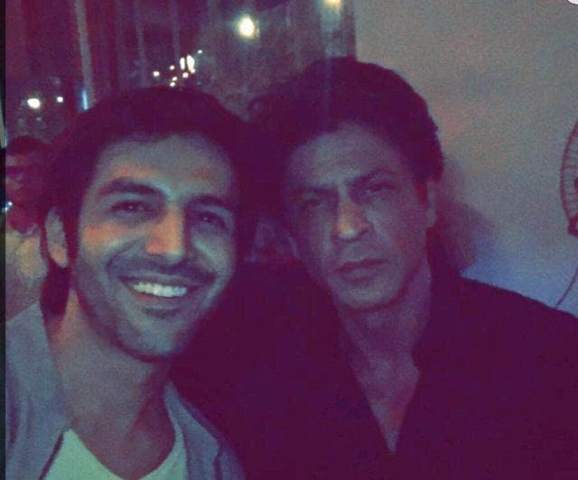 Actor Kartik Aaryan with actor Shah Rukh Khan.