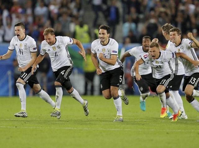 German players set off to celebrate after the winning penalty. (AP) German players set off to celebrate after the winning penalty. (AP)
