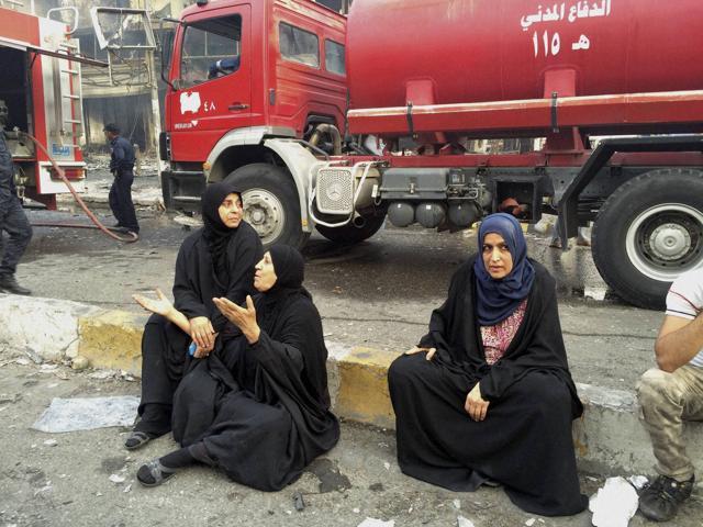 Iraqi women wait for their family members who are missing after a car bomb at a commercial area in Karada neighborhood, Baghdad, Iraq. (AP Photo) Iraqi women wait for their family members who are missing after a car bomb at a commercial area in Karada neighborhood, Baghdad, Iraq. (AP Photo)