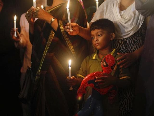 A Bangladeshi boy holds a Spiderman toy in one hand and a lighted candle in the other as he joins others in paying tribute to those killed in the attack at the Holey Artisan Bakery in Dhaka, Bangladesh. (AP Photo) A Bangladeshi boy holds a Spiderman toy in one hand and a lighted candle in the other as he joins others in paying tribute to those killed in the attack at the Holey Artisan Bakery in Dhaka, Bangladesh. (AP Photo)