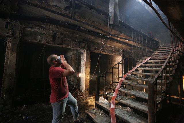 An Iraqi Man looks for victims at the site of a car bomb attack at a commercial area in Karada neighborhood,Baghdad. (AP Photo) An Iraqi Man looks for victims at the site of a car bomb attack at a commercial area in Karada neighborhood,Baghdad. (AP Photo)