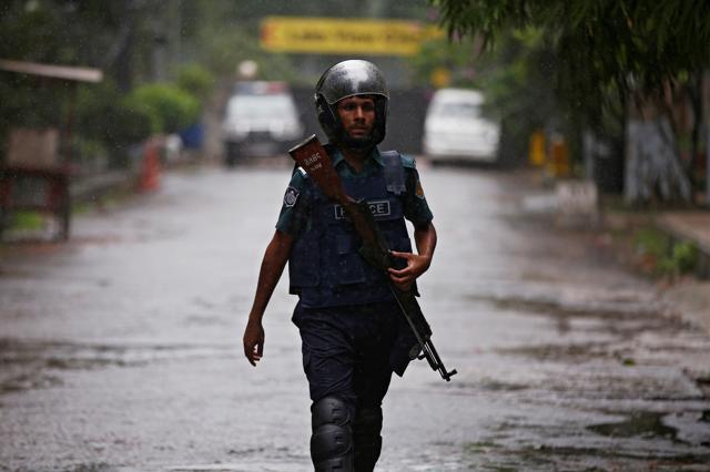 A policeman patrols on the road leading to the Holey Artisan Bakery and the O'Kitchen Restaurant after gunmen attacked, in Dhaka, Bangladesh. (Reuters) A policeman patrols on the road leading to the Holey Artisan Bakery and the O'Kitchen Restaurant after gunmen attacked, in Dhaka, Bangladesh. (Reuters)