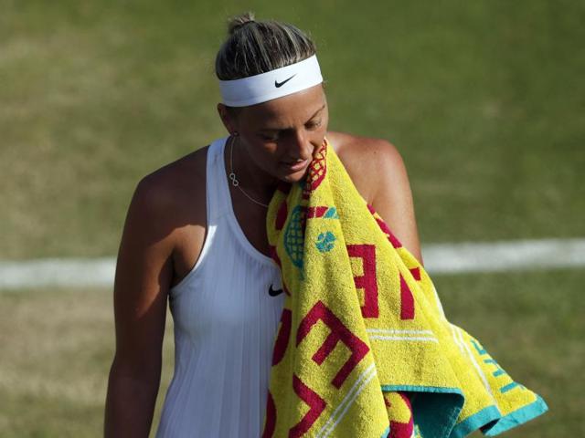 Petra Kvitova of the Czech Republic wipes her face during her women's singles match against Ekaterina Makarova of Russia on day six of the Wimbledon Tennis Championships in London. (AP Photo) Petra Kvitova of the Czech Republic wipes her face during her women's singles match against Ekaterina Makarova of Russia on day six of the Wimbledon Tennis Championships in London. (AP Photo)
