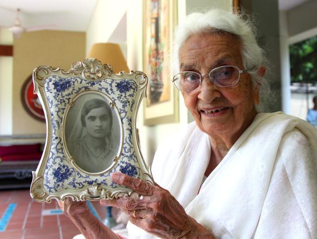 LOVE STORY 1932: Iqbal Kaur Randhawa, 100, showing her photo as a 16-year-old newlywed, at her home in Sector 9, Chandigarh. The photo was taken at Lyallpur, Pakistan, in 1932 to be sent to MS Randhawa, who was in London for the Indian Civil Service training. (Anil Dayal/HT Photo) LOVE STORY 1932: Iqbal Kaur Randhawa, 100, showing her photo as a 16-year-old newlywed, at her home in Sector 9, Chandigarh. The photo was taken at Lyallpur, Pakistan, in 1932 to be sent to MS Randhawa, who was in London for the Indian Civil Service training. (Anil Dayal/HT Photo)