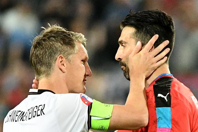 Buffon greets Germany's midfielder Bastian Schweinsteiger after the match. (AFP) Buffon greets Germany's midfielder Bastian Schweinsteiger after the match. (AFP)