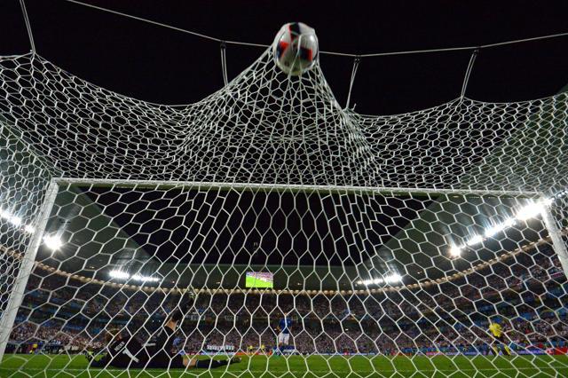 Germany's goalkeeper Manuel Neuer misses the ball by Italy's defender Andrea Barzagli during a spot-kick during the penalty shootout. (AFP Photo) Germany's goalkeeper Manuel Neuer misses the ball by Italy's defender Andrea Barzagli during a spot-kick during the penalty shootout. (AFP Photo)
