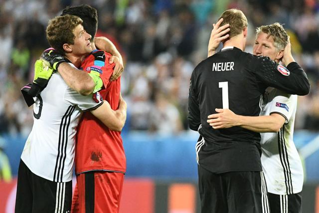 Italy's goalkeeper Gianluigi Buffon (2nd left) congratulates Germany's midfielder Thomas Mueller as German goalkeeper Manuel Neuer celebrates with Bastian Schweinsteiger (right) after Germany won the match. (AFP Photo) Italy's goalkeeper Gianluigi Buffon (2nd left) congratulates Germany's midfielder Thomas Mueller as German goalkeeper Manuel Neuer celebrates with Bastian Schweinsteiger (right) after Germany won the match. (AFP Photo)