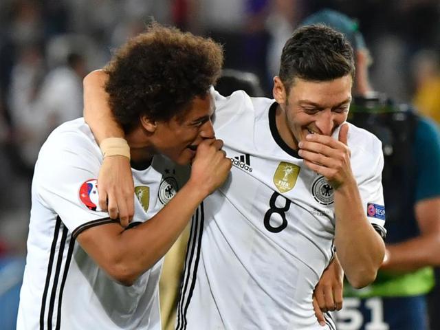 Germany's midfielder Mesut Ozil (right) and Germany's midfielder Leroy Sane celebrate after winning the Euro 2016 quarterfinal football match. (AFP Photo) 