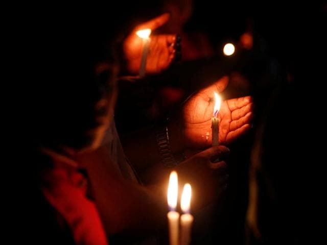 Bangladeshis light candles and sing songs as they pay tribute to those killed in the attack at the Holey Artisan Bakery in Dhaka on Sunday. (AP) Bangladeshis light candles and sing songs as they pay tribute to those killed in the attack at the Holey Artisan Bakery in Dhaka on Sunday. (AP)