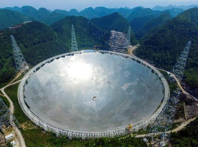 A 500-metre (1,640-ft) aperture spherical telescope (FAST) is seen at the final stage of construction, among the mountains in Pingtang county, Guizhou province. (Reuters) A 500-metre (1,640-ft) aperture spherical telescope (FAST) is seen at the final stage of construction, among the mountains in Pingtang county, Guizhou province. (Reuters)
