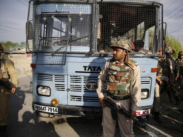 Security personnel stand guard near a damaged bus that was carrying paramilitary soldiers after a highway ambush by militants in Pampore on the outskirts of Srinagar on June 25, 2016. (Waseem Andrabi/ HT Photo) Security personnel stand guard near a damaged bus that was carrying paramilitary soldiers after a highway ambush by militants in Pampore on the outskirts of Srinagar on June 25, 2016. (Waseem Andrabi/ HT Photo)